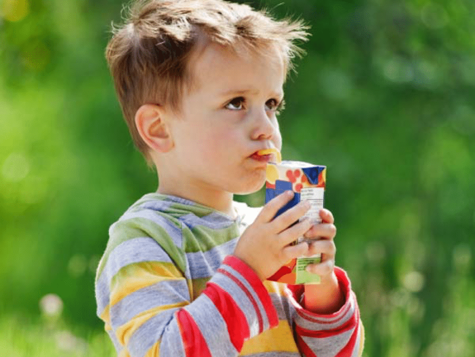 A boy drinking juice